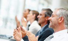 Group Of Happy Business People Clapping Their Hands
